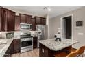 Well-equipped kitchen showcasing granite countertops, stainless steel appliances, and ample cabinetry at 2023 W Yellowbird Ln, Phoenix, AZ 85085