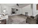 Inviting living room with plush carpeting, neutral walls, and a ceiling fan at 2233 E Behrend Dr # 162, Phoenix, AZ 85024