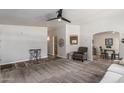Spacious living room features neutral walls, plush carpeting, and an overhead fan at 2233 E Behrend Dr # 162, Phoenix, AZ 85024
