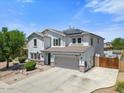 Beautiful two-story home with a well-kept lawn, solar panels, and an attached two-car garage in a desirable neighborhood at 2466 E Harrison Ct, Gilbert, AZ 85295