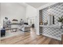 Bright living room with high ceilings, hardwood floors, and chic decor, creating a comfortable and stylish space at 2466 E Harrison Ct, Gilbert, AZ 85295