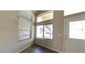 Bright entryway featuring high ceilings and abundant natural light from multiple windows at 24919 W Illini St, Buckeye, AZ 85326