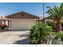 Spacious two-car garage with desert landscaping enhancing curb appeal to this single Gathering home at 3755 E Hazeltine Way, Chandler, AZ 85249