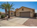 Attractive single-story home with a desert-themed front yard and a convenient two-car garage at 5312 S 33Rd Ave, Phoenix, AZ 85041
