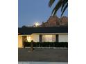 Lovely home at nighttime, featuring a well maintained yard and illuminated exterior under the moonlight at 5625 N 45Th St, Phoenix, AZ 85018