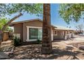 View of a single-story home showcasing side and front with mature landscaping at 6334 N 37Th Ave, Phoenix, AZ 85019