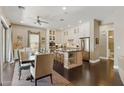 Bright kitchen with stainless steel appliances, spacious island, and a dining area nearby at 7122 W Ivanhoe St, Chandler, AZ 85226
