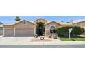 Charming single-story home with a well-maintained front yard and desert landscaping at 758 S Lagoon Dr, Gilbert, AZ 85233