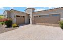 Stunning home featuring a spacious three-car garage and elegant architectural details at 8396 E Granite Pass Rd, Scottsdale, AZ 85266