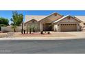 Charming single-story home with desert landscaping, a two-car garage, and a welcoming front entrance at 9109 W Watson Ln, Peoria, AZ 85381