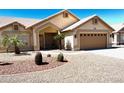 Charming single-story home with desert landscaping, a two-car garage, and a welcoming front entrance at 9109 W Watson Ln, Peoria, AZ 85381