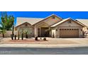 Charming single-story home with desert landscaping, inviting entrance and an attached two car garage at 9109 W Watson Ln, Peoria, AZ 85381