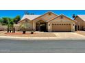 Charming single-story home with well-maintained desert landscaping and an attached two-car garage at 9109 W Watson Ln, Peoria, AZ 85381
