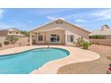 Backyard features a sparkling pool and patio area, perfect for outdoor entertaining at 9239 E Karen Dr, Scottsdale, AZ 85260