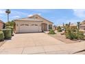 Well-kept home with a two-car garage and desert landscaping in a quiet neighborhood at 9239 E Karen Dr, Scottsdale, AZ 85260