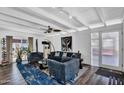 Inviting living room featuring vaulted ceilings, a ceiling fan, and stylish, comfortable blue furniture at 1029 E Palo Verde Dr, Phoenix, AZ 85014