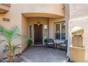 Inviting entryway features a charming seating area and water feature for a relaxing welcome at 15240 N Clubgate Dr # 160, Scottsdale, AZ 85254