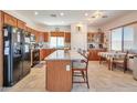 Well-lit kitchen featuring a large island with granite countertops and stainless steel appliances at 18118 N Smith Dr, Maricopa, AZ 85139
