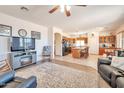 Spacious living room showcasing an open layout connecting to the kitchen and dining area at 18118 N Smith Dr, Maricopa, AZ 85139