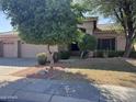 Well maintained single-story home featuring desert landscaping and a three-car garage at 20609 N 57Th Dr, Glendale, AZ 85308