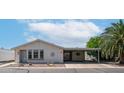Single-story home with neutral siding, carport, and desert landscaping at 2400 E Baseline Ave # 197, Apache Junction, AZ 85119
