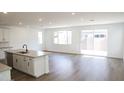 Spacious living room featuring recessed lights and sliding glass door leading to backyard at 2482 W Rowel Rd, Phoenix, AZ 85085