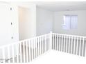 Upstairs loft with neutral carpet and a window allowing natural light at 2482 W Rowel Rd, Phoenix, AZ 85085