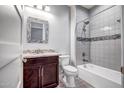 Bathroom with a shower over tub, updated vanity, and modern finishes at 26141 N 133Rd Ave, Peoria, AZ 85383