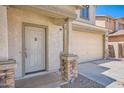 Welcoming entryway featuring a stylish front door, stone accents, and a covered porch at 3719 E Longhorn St, San Tan Valley, AZ 85140