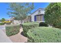 This charming single-Gathering home has mature bushes, desert landscaping, and a spacious two-car garage at 41004 W Crane Dr, Maricopa, AZ 85138