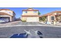 Two-story home with a red tile roof, attached garage, and low maintenance landscaping at 4545 N 67Th Ave # 1101, Phoenix, AZ 85033