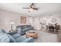 Well-lit living room showcasing stylish seating, decorative wall art, and open access to dining at 6480 N 82Nd St # 1136, Scottsdale, AZ 85250