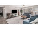 Bright living room with cozy seating, modern rug, and easy access to outdoor space at 6480 N 82Nd St # 1136, Scottsdale, AZ 85250