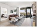 Comfortable living room with stylish decor and a door leading to the bedroom at 7180 E Kierland Blvd # 811, Scottsdale, AZ 85254