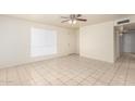 Bright and airy living room featuring tile flooring and a ceiling fan at 7360 N 38Th Dr, Phoenix, AZ 85051