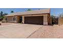 Single-story home with desert landscaping, a two-car garage, and a blue front door at 846 N 81St St, Mesa, AZ 85207