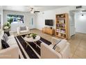 The living room features stylish furniture, natural light, and tile floors at 920 E Garnet Ave, Mesa, AZ 85204