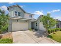 Beautiful two-story home featuring a three-car garage and landscaped front yard at 10144 E Toledo Ave, Mesa, AZ 85212
