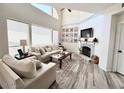 Bright living room with vaulted ceiling, fireplace, and stylish furnishings at 10229 N 12Th Ct # 1, Phoenix, AZ 85020