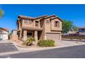 Charming corner-lot home featuring a neutral color scheme, attached two-car garage, and well-maintained landscaping at 1145 E Lowell Ave, Gilbert, AZ 85295