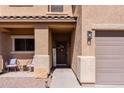 Inviting front porch with a cozy seating area and stylish decor, enhancing the curb appeal of the home at 1145 E Lowell Ave, Gilbert, AZ 85295