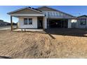 New home construction showcasing the exterior, unfinished but showing the frame and foundation at 15796 W Beryl Ave, Waddell, AZ 85355