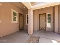 Covered entryway featuring decorative security doors, providing both style and security at 16785 W Montana De Oro Dr, Surprise, AZ 85387