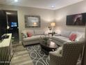 Cozy living room featuring plush seating, stylish decor, and ample natural light at 2110 E Williams Dr, Phoenix, AZ 85024
