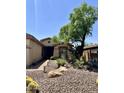 Attractive desert landscaping with a brick walkway leads to the front door of this inviting home at 2461 W Muirfield Dr, Anthem, AZ 85086
