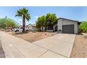 Charming single-story home with well-maintained landscaping, mature tree, and concrete driveway at 3039 W Ross Ave, Phoenix, AZ 85027