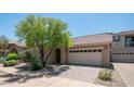 Charming single-story home featuring a tile roof, desert landscaping, and a two-car garage at 3439 W Darien Way, Phoenix, AZ 85086