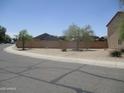 A view of the property from across the street showing desert landscaping at 40504 N Las Praderas St, San Tan Valley, AZ 85140