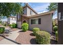 Two-story home with well-maintained landscaping, sidewalk and neutral stucco at 4743 E Laurel Ave, Gilbert, AZ 85234