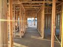 Hallway area framed with wooden beams and studs, showcasing the layout of this modern house at 5512 W Piedmont Rd, Laveen, AZ 85339